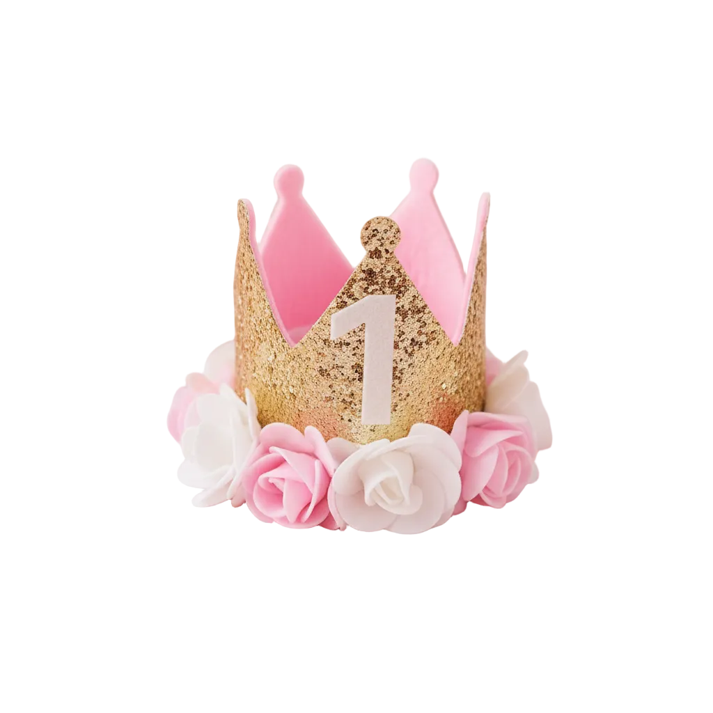 First Birthday Crown Hat styled with rose petals and gold confetti on pastel pink background